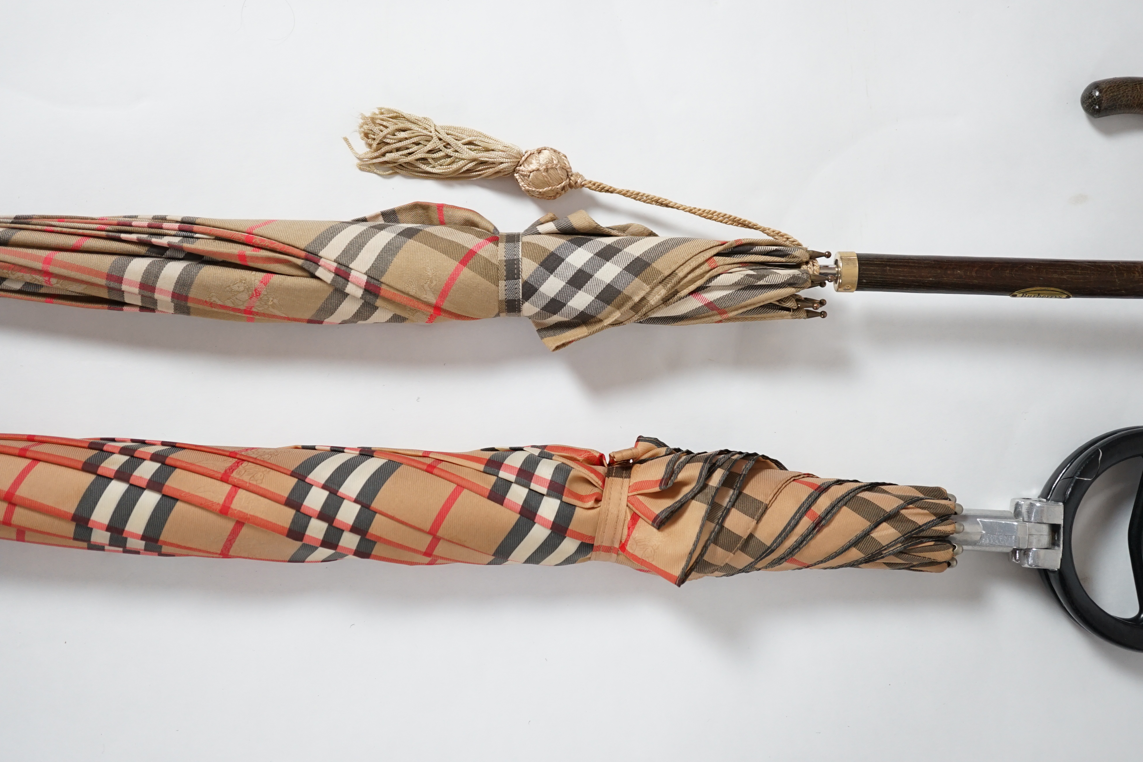 A vintage Burberry shooting stick umbrella and a lady's vintage cotton umbrella, shooting stick height 91cm, umbrella 83cm